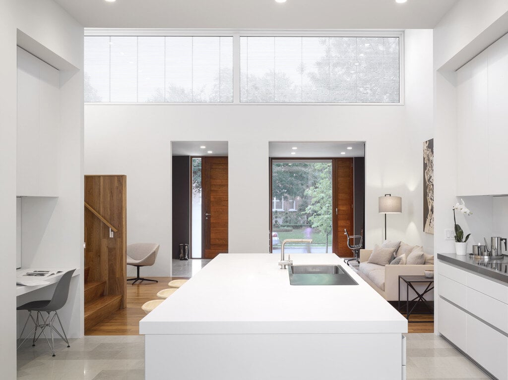 Bulthaup kitchen with white flat-panel cabinetry in Toronto custom home by SevernWoods