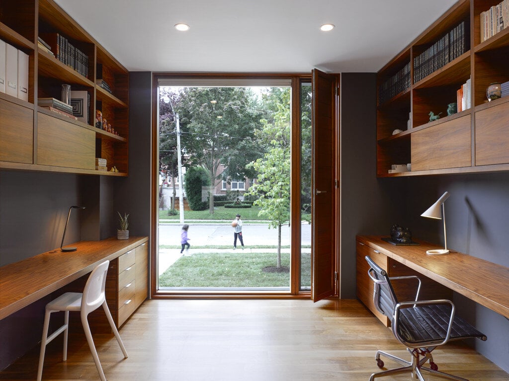 Home office with Bauhaus window and door opening to outside in Toronto custom home by SevernWoods