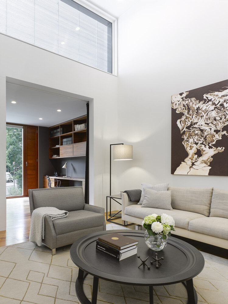 Living room in Toronto luxury custom home by SevernWoods with no baseboard design