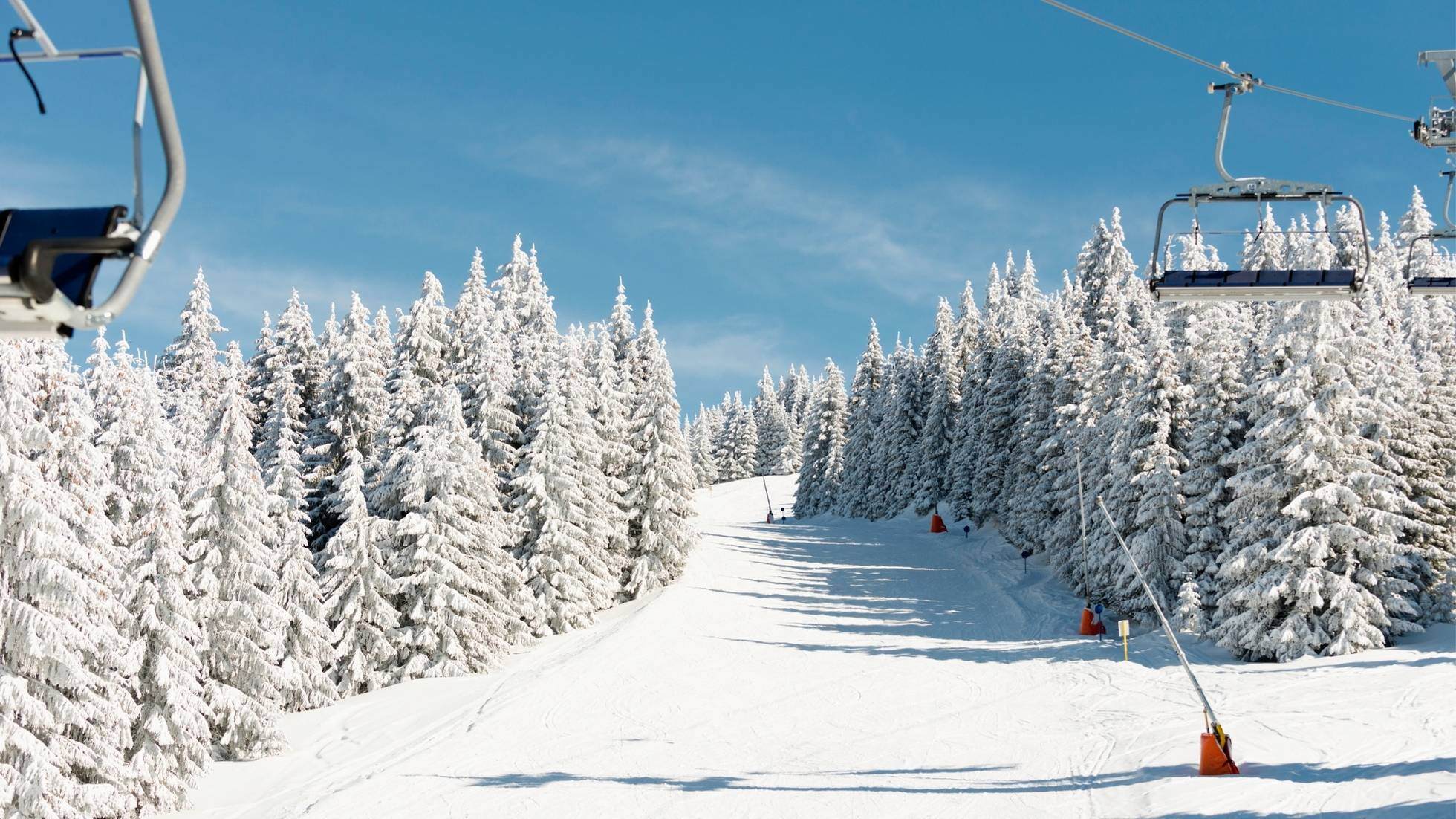 Ski resort in Toronto with lifts going up slope on sunny day