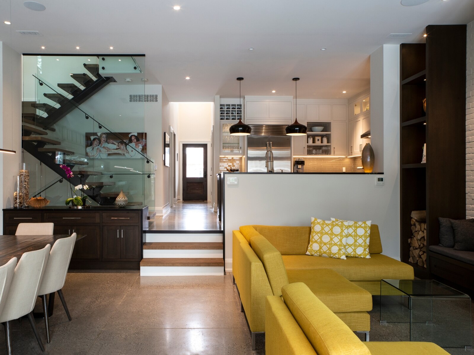 Toronto home renovation living room and kitchen with floating stair case
