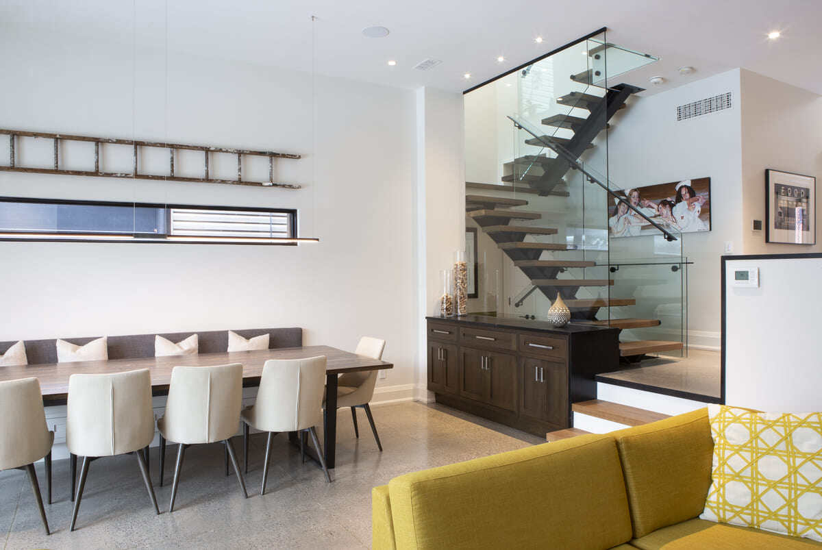 Toronto sustainable home renovation interior with glass staircase
