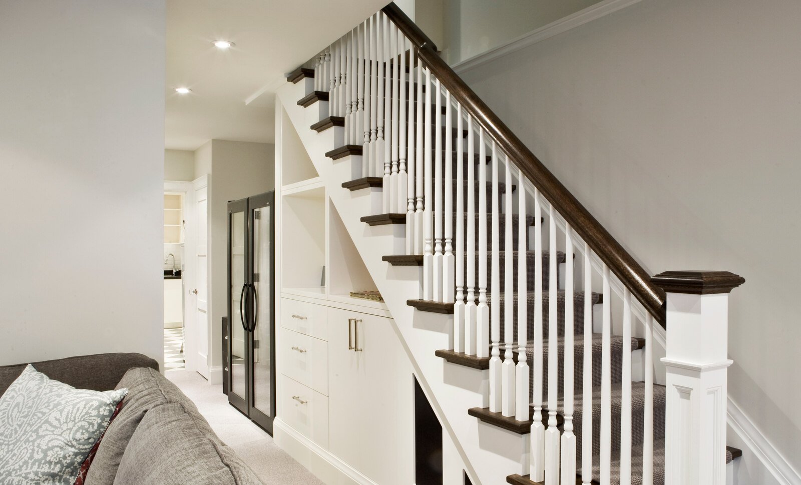 Underpinned basement with storage compartments under stairs and 10 foot ceilings