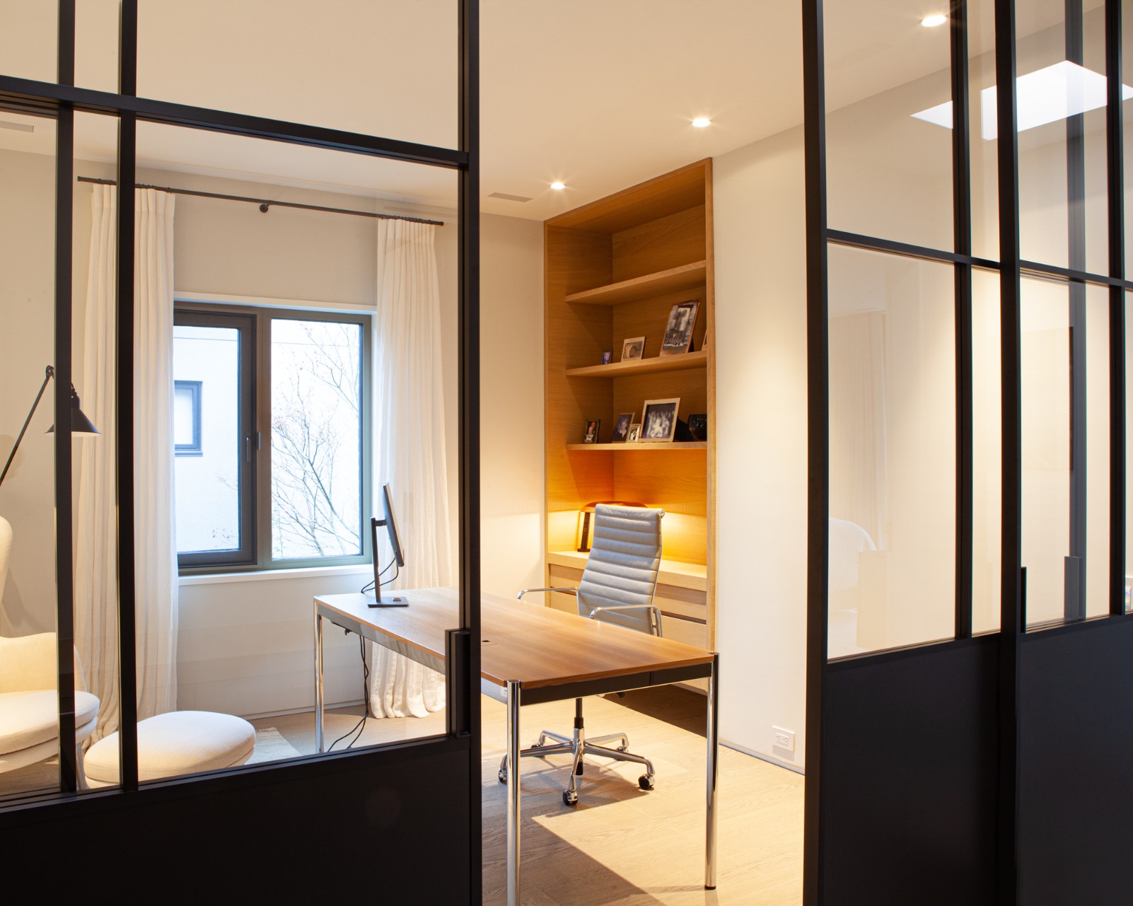 Home office with custom lighting in Toronto home renovation by SevernWoods