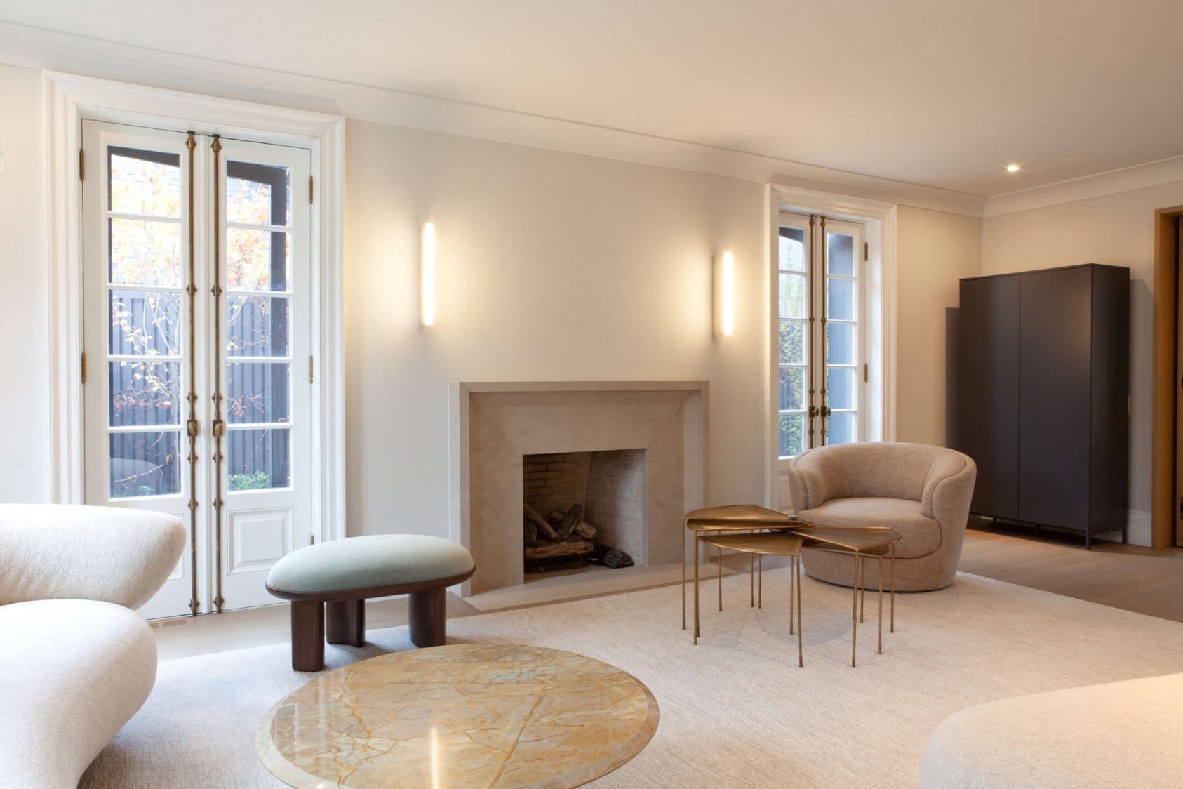 Modern fireplace with stone mantle on first floor of Toronto addition and renovation by SevernWoods